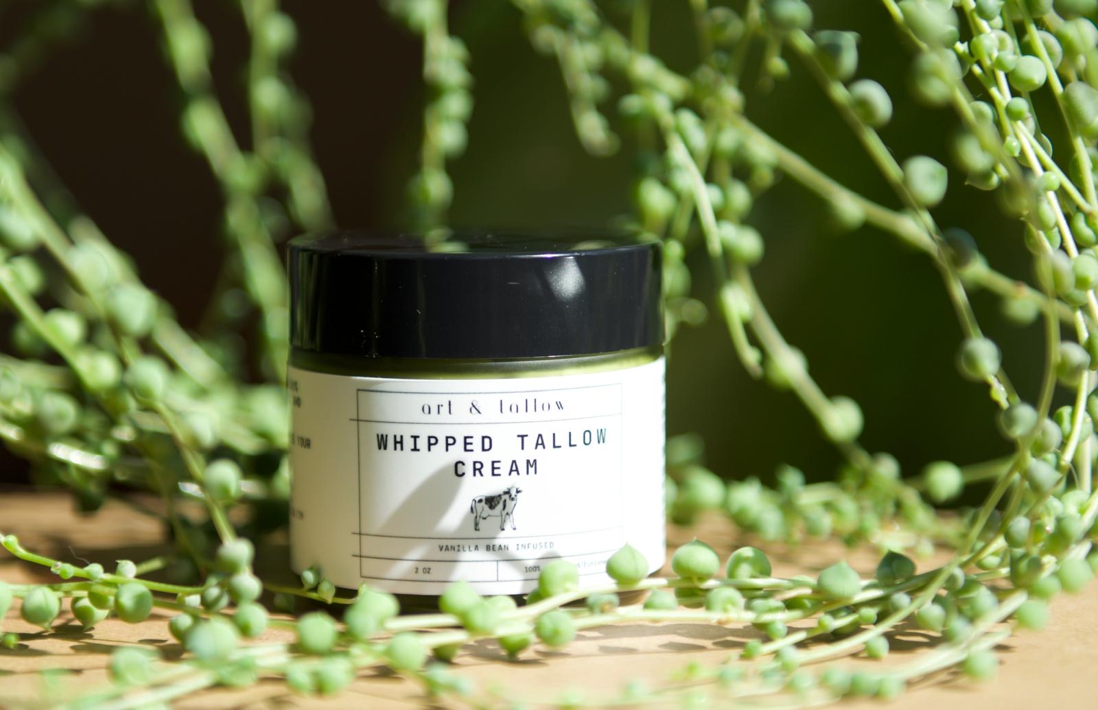 Jar of whipped talon cream surrounded by greenery